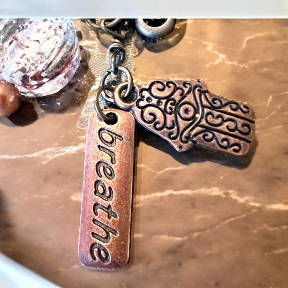 Unique bronze necklace key and charm details clear glass bead and 'breathe' tag. - Picture 9 of 15